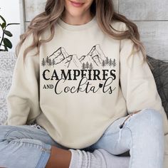 NOTE: 🌲 Forest Green & Black will have an ivory text (not white). Perfect for outdoor enthusiasts who love to blend the thrill of the wilderness with a dash of cocktail fun. Crafted with comfort in mind, this cozy sweatshirt is ideal for chilly evenings around the campfire or casual outings with friends.  IMPORTANT Mockups are used for demonstration purposes only, and the final product may vary slightly in color & placement. ⭐SIZE & FIT: Unisex Heavy Blend™ Sweatshirt IMPORTANT: Design is scale White T-shirt For Outdoor Winter Activities, Letter Print Top For Camping In Fall, White Letter Print Sweatshirt For Camping, White Letter Print Sweatshirt For Outdoor, White Long Sleeve Sweatshirt For Camping, Mountain Woman, Sweatshirt Ideas, Woman Hiking, Camping Hoodie