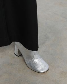 Ankle boot Made by hand in Italy In Harlow, silver becomes a lust-worthy neutral that will readily rotate with your favourite wardrobe staples. We’re styling to bring an ethereal touch to dark suiting. Description A sleek boot shaped by softened lines, including a rounded toe inspired by that of our classic Harlow Pump. Finished in silver crake lamé with flared block heel, internal zipper and buffed outsole. Details Heel height: 7.5cm (3 inches) 100% Italian leather upper. Hand stitched. Leather Metallic High Heel Boots For Formal Occasions, Elegant Metallic Boots With Round Toe, Elegant Silver Heeled Boots For Fall, Elegant Metallic Round Toe Boots, Silver Heeled Boots With Round Toe For Formal Occasions, Silver Chic Heeled Boots For Formal Occasions, Chic Silver Heeled Boots For Formal Occasions, Chic Silver Heeled Boots For Formal Events, Metallic Boots For Formal Fall Occasions