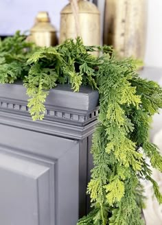 a close up of a wreath on top of a fireplace