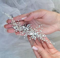 Our elegant Crystal Butterfly Wedding Hair Comb, a stunning accessory for your special day. This bridal hair comb is hand crafted with crystals, creating a glamorous and sophisticated look. Perfect for brides, bridesmaids, or any special occasion, this hair comb adds a touch of sparkle and style to your hairstyle. It effortlessly complements any wedding updo, enhancing your overall bridal look. ❤ Beautiful silver butterfly bridal hair comb for your special day!  ❤ Wedding hair comb is the perfect wedding hair accessory for the bride. ❤ This bridal hair piece is soft and flexible and can be worn at the front as a headband, back or side of your hair and can be shaped to suit any hairstyle. ❤ Handmade  ❤ Length of comb - 7 inches Butterfly Wedding Hair, Pearl Wedding Hair, Bridal Hair Combs Pearl, Wedding Bridal Hair, Bridal Hair Piece, Wedding Hair Comb, Butterfly Wedding, Crystal Butterfly, Wedding Updo