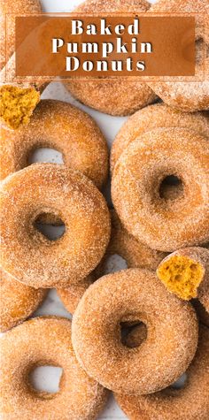 baked pumpkin donuts are piled on top of each other with the words baked pumpkin donuts above them