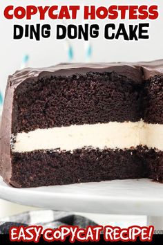 there is a chocolate cake with white frosting on it