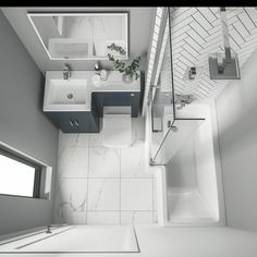 an aerial view of a white tiled bathroom