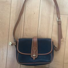 Like New! Dooney And Bourke Bag. Blue Leather With Brown Trim. Never Used And In Great Condition. Vintage Blue Shoulder Bag With Leather Handles, Vintage Blue Bag With Gold-tone Hardware, Blue Vintage Bag With Gold-tone Hardware, Classic Blue Bag With Leather Trim, Brown Trim, Dooney And Bourke, Dooney & Bourke Bags, Dooney & Bourke, Dooney Bourke