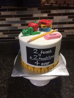 there is a cake that has been decorated with school supplies on the top of it