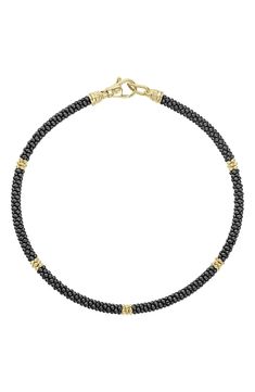 Classically elegant, this handcrafted station bracelet features Caviar beading in both gleaming 18-karat gold and striking black ceramic. Style Name:Lagos Gold & Black Caviar Rope Bracelet. Style Number: 5618092. Available in stores. Elegant Yellow Gold Bracelets With Black Beads, Elegant Yellow Gold Bracelet With Black Beads, Elegant Black Bracelet With Sterling Silver Clasp, Elegant Black Bracelet With Lobster Clasp, Station Bracelet, Bony Levy, Gold Ceramic, Black Caviar, Black Ceramic