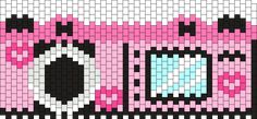 an image of a pixelated camera with pink and black accents on it's face