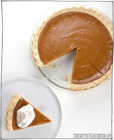 a piece of pie on a plate next to another pie with one slice missing from it