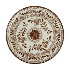 a brown and white plate with flowers on it