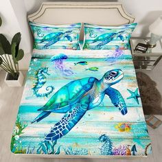 a bed with a blue sea turtle on it