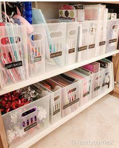 plastic storage bins are stacked on top of each other in this craft organization unit