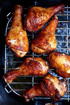 chicken wings are cooking on the grill and being cooked for dinner or as an appetizer