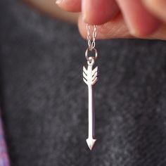 The cupid arrow necklace is handmade in the uk in Sterling Silver. Simple, versatile and made for layering :) The arrow hangs on a 20 inch chain so that it is a good length for teaming up with your other necklaces. It is one of my new faves as it can be mixed and matched and it super wearable for everyday style. The arrow measures 28mm in length and has been fully hallmarked at the London Assay Office. We can also make this to order in yellow, white or rose gold. The necklace will arrive in a Ro Arrow Necklace Silver, Silver Arrow, Arrow Pendant, Cupids Arrow, Layered Necklaces Silver, The Arrow, Daily Jewelry, Handmade Charms, Layering Necklace