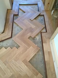 the floor is being sanded down and installed with some wood planks to make it look like an arrow