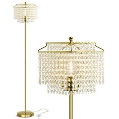 a lamp that is on top of a table next to a floor lamp with a glass shade