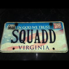 a license plate that reads in god we trust squad virginia