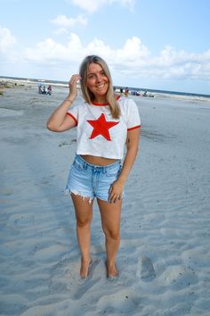 Crew Neck Tops With Star Logo For Summer, Casual Summer Tops With Star Logo, Cotton T-shirt With Star Patch For Summer, Cotton Crew Neck Top With Star Patch, White Summer T-shirt With Star Patch, White Summer Tops With Star Logo, Red Star Print Top For Summer, Red Short Sleeve Top With Star Print, White Cotton Tops With Star Patch