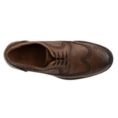 Meet our Ellis oxford shoes and experience luxurious comfort with every step. Featuring a classic wingtip design, lace-up closure, and intricate punch-hole detailing, these shoes combine timeless elegance with modern durability. Perfect for the discerning gentleman, the Ellis oxford offers both style and function, making it a must-have addition to any refined wardrobe. Enjoy the perfect blend of sophistication and comfort, ensuring you look sharp and feel great for any occasion. Brown Formal Masculine Oxfords, Vintage Leather-lined Oxfords For Derby, Masculine Brown Oxford Dress Shoes, Brown Slip-on Oxfords For Derby, Brown Leather-lined Oxfords For Derby, Dress Loafers, Wingtip Oxford, Clog Slippers, Closed Toe Shoes