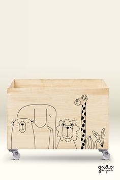 a wooden box with an animal design on it