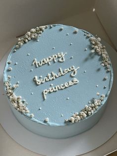 a blue birthday cake with white frosting that says happy birthday princess