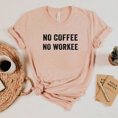 This cute No Coffee No Workee shirt is perfect for everyone who needs a cup of coffee or two first thing in the morning! All of our shirts are super soft and cozy.  HOW TO ORDER 1. Check photos for sizing and color options 📏 2. Select size and color from the drop down menus ✨ 3. Add to cart & Place order 🛒 4. Your shirt is now off to production and will be ready for shipment in 1-5 days! 🎁 (Note: Holidays production time may extend - check shop announcement for updates in busier Holiday times Coffee Color Crew Neck T-shirt For Everyday, Coffee Color Crew Neck Top For Everyday, Coffee Color Graphic Tee For Everyday, Coffee Colored Crew Neck T-shirt For Everyday, Everyday Coffee-colored Graphic Tee, Coffee Color Cotton T-shirt With Funny Text, Coffee Color Cotton Top With Funny Text, Coffee Colored Cotton T-shirt With Funny Text, Coffee Colored Cotton Top With Funny Text