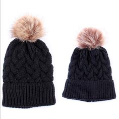 two hats with pom poms on them