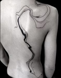 the back of a woman's body with lines on it