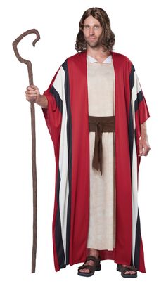 a man dressed as jesus holding a staff