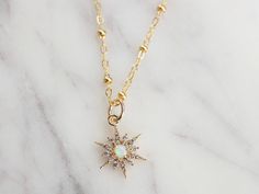 ∙ ∙ S T A R B U R S T ∙ N E C K L A C E ∙ ∙ Made with the following: Gold Plated Opal Star Pendant 11mm 14K Gold Filled Chain 14K Gold Filled Findings 14K Gold Filled Spring Clasp This listing is for one necklace. ∙ ∙ H O W ∙ T O ∙ O R D E R ∙ ∙ Please select the length from the drop-down menu. Please select if you would like a 2-inch extender chain from the drop-down menu. The 2-inch extender gives you the flexibility to wear the necklace the length you choose and up to 2 inches longer. (Exampl Star-shaped Opal Jewelry Gift, Celestial Opal Necklace As A Gift, Celestial Opal Necklace As Gift, Celestial Opal Necklace For Gift, Starburst Necklace, Necklace Opal, Gold Vermeil Jewelry, Celestial Necklace, Earring Cards