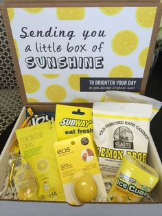 an open box filled with various items including lemonade, soaps and other things