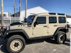 a jeep is parked in a parking lot