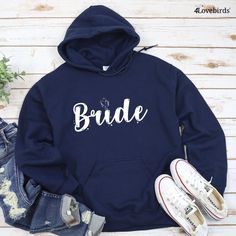 Complete your bridesmaids' coordinated look with matching couples' hoodies, sweatshirts, shirts and more! Choose from a variety of matching shirts, hoodies, and sweatshirts to find the perfect fit for your bridesmaids. Find matching sets for couples, husband and wife matching shirts, and funny matching shirts for couples. Pick out a perfect matching set for you and your bridesmaids today! Bride Tribe Shirt, Bride Hoodie, Married Shirt, Engaged Shirts, Matching Hoodies, Honeymoon Shirts, Bachelorette Party Outfit, Matching Sweatshirts, Bride And Groom Gifts