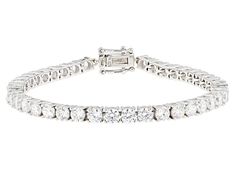 Bella Luce® white diamond simulant 17.37ctw round, rhodium over sterling silver tennis bracelet. Measures approximately 7.25"-8" L x 0.19" W and has a box clasp closure. Diamond equivalent weight is 10.51ctw. Channel Set Cubic Zirconia Tennis Bracelet, Cubic Zirconia Channel Set Tennis Bracelet, White Tennis Bracelet For Formal Occasions, White Diamond Bracelet With Accents, Silver Channel Set Tennis Bracelet, White Brilliant Cut Tennis Bracelet, White Bracelet With Diamond Accents, Formal White Tennis Bracelet With Diamond Accents, Classic White Round Tennis Bracelet