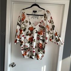 Nwot, Perfect Condition V Neck Sweater, 3/4 Sleeves With Colorful Floral Print Of Orange Flowers On White Background. Never Worn, Ladies Size Xl. Measures Approximately 28” From Shoulder Seam To Bottom, 25” Across Front Bust. Dolman Style Sleeves, No Seam. Never Worn White Floral Print Blouse With 3/4 Sleeves, Oversized White Floral Print Blouse, Oversized White Blouse With Floral Print, Floral Print Sweater, Print Sweater, Printed Sweater, Orange Flowers, V Neck Sweater, Vneck Sweater