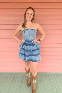 Get ready to wrangle some hearts in our Country Belle Denim Ruffle Layered Mini Dress! This strapless wonder features a flirty ruffle layered design that's perfect for square dancing, all those country concerts, game day and so much more!  And with a washed denim finish, you'll feel like a true western beauty. We love it with our Mariposa butterfly boots for an extra feminine touch!  #shoponline #onlineboutique #denimdress #butterflyboots Butterfly Boots, Layered Mini Dress, Denim Ruffle Dress, Zach Bryan, Square Dancing, Country Concerts, Layered Design, Boutique Tops, Washed Denim