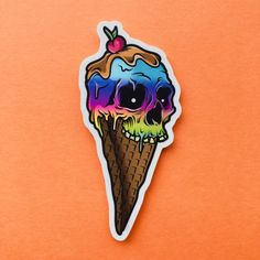 an ice cream sticker with a skull in the cone on it's side