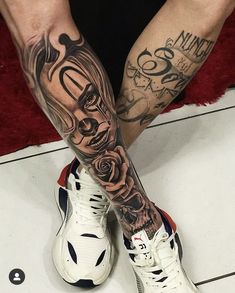 a man's legs with tattoos and sneakers