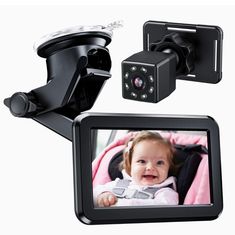 two cameras and a baby's head mounted to the side of a car mirror