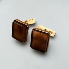 Thank you for visiting the SoChicFinds store - vintage and antique, costume and fine jewelry.  Square brown gemstone cufflinks with chain link closure. Metal: gold plated silver (vermeil).  Gemstone: square shaped brown chalcedony.  Weight of the chalcedony cufflinks: 7,11 grams. Hallmark: USSR, 1969, Purity of silver 875. Vintage cuff links in excellent condition. Square Brown Chalcedony Chain Link Cufflinks, Gold Plated Sterling Silver Cuff Link, 1960s Vintage 875 Silver  Jewelry for Men Mid-century Polished Formal Jewelry, Vintage Polished Cuff Jewelry, Antique Screw Back Jewelry For Formal Occasions, Art Deco Clip-on Jewelry For Formal Occasions, Formal Art Deco Clip-on Jewelry, Clip-on Art Deco Jewelry For Formal Occasions, Victorian Screw Back Jewelry For Formal Occasions, Victorian Formal Jewelry With Screw Back, Vintage Gold Cuff Jewelry