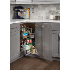 an open cabinet in the corner of a kitchen