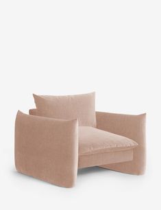 a beige chair with pillows on it