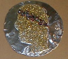 a piece of tin foil with gold glitter on it