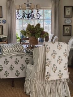 a dining room table with chairs covered in covers