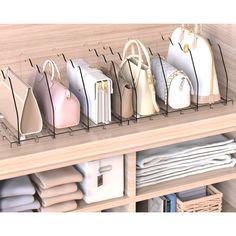 several purses are lined up on a shelf