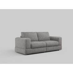 a gray couch sitting on top of a white floor