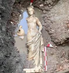 there is a statue that has been placed in the mud