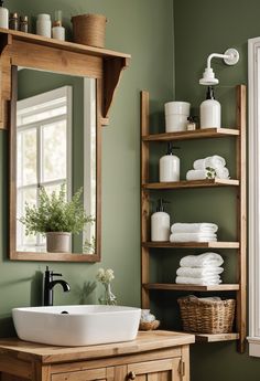 27 Gorgeous Green Bathroom Ideas for a Fresh Look Olive Colored Bathroom, Green Furniture Bathroom, Green Bathroom With Wood Vanity, Cosy Bathroom Design, Eucalyptus Color Bathroom, Bathroom Olive Green Walls, Cottage Green Bathroom, Cosy Bathroom Decor, Sage Green Farmhouse Bathroom