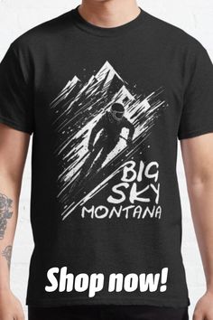 a man wearing a black shirt with the words big sky montana on it