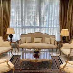 a living room with couches, chairs and lamps in front of a window filled with curtains