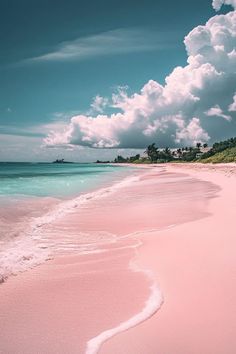 the beach is pink and blue with white clouds